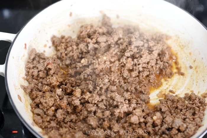 Cooked hamburger mixture in a large skillet. 