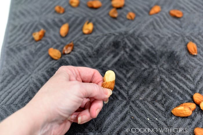 Squeeze the almonds out of their skins. 