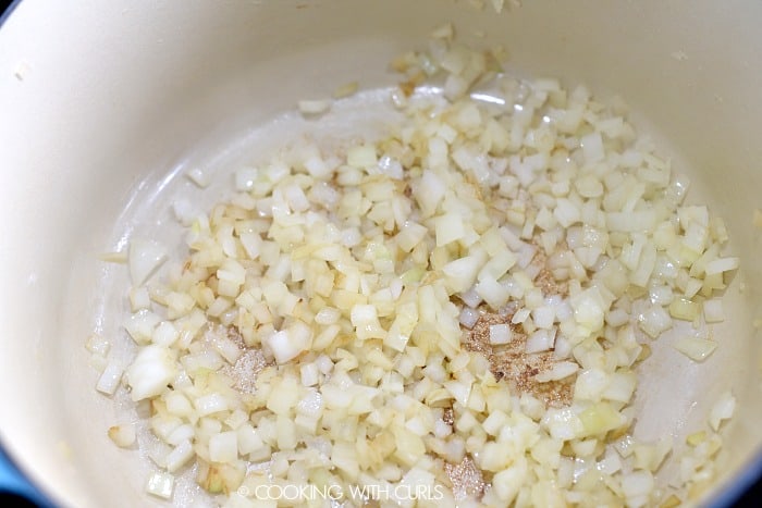 Cooked, diced onions in a Dutch oven. 