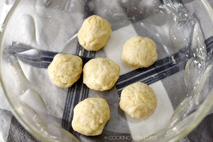 Herb dumpling dough rolled into 6 balls. 