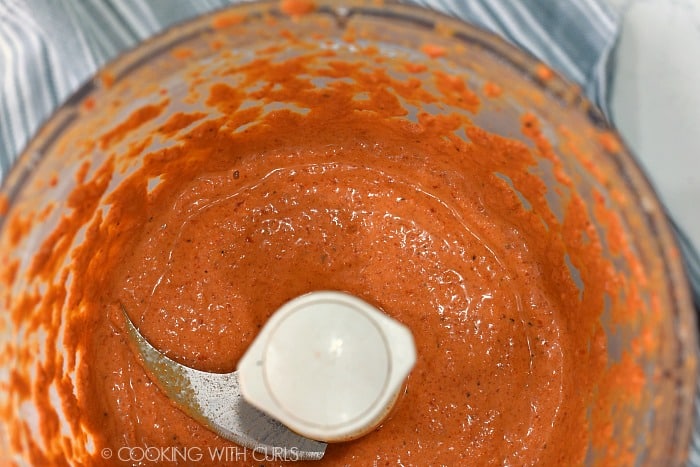 Red Pepper Pesto Sauce pureed in a food processor. 