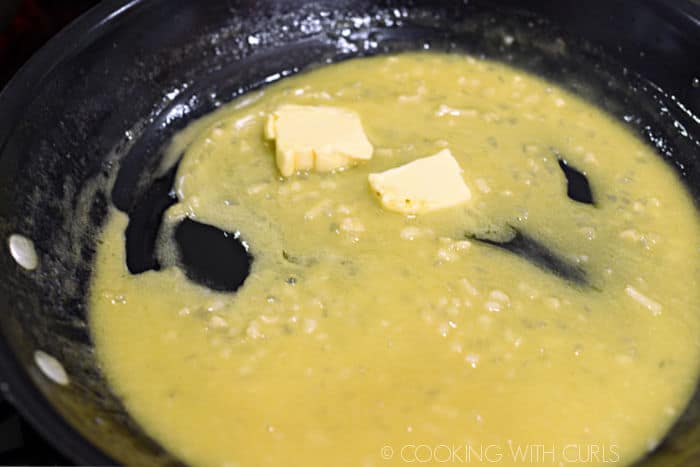 butter melting into the garlic wine mixture. 