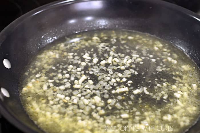 minced garlic, onion and white wine in a skillet. 