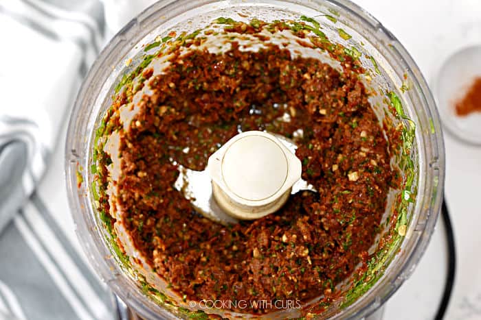 sun-dried tomatoes, basil, garlic and walnuts pulverized in a food processor. 