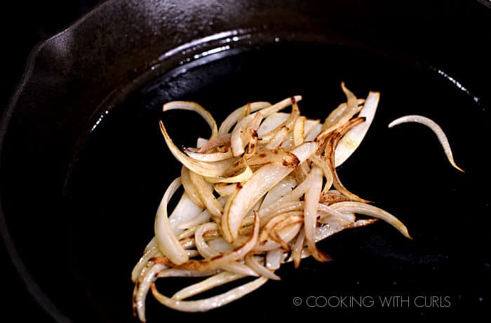 thinly sliced caramelized onions in a cast iron skillet. 