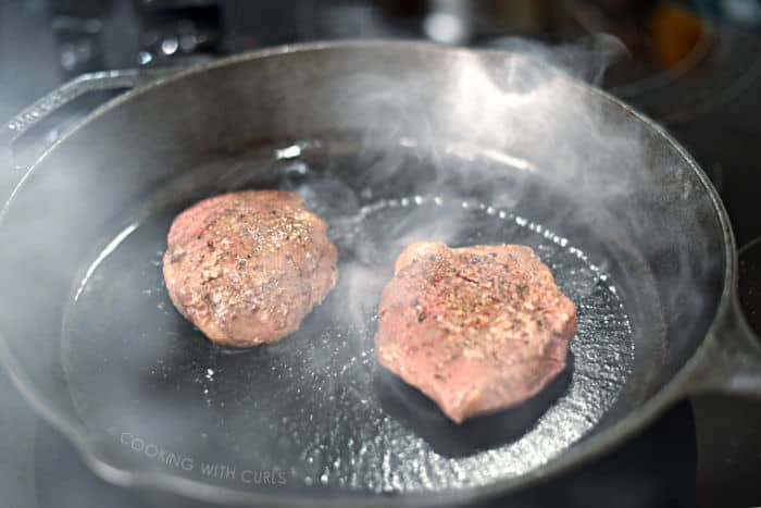 searing two filets in a hot cast iron skillet. 