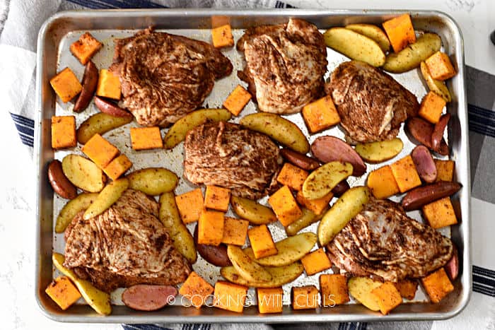 looking down on autumn sheet pan chicken dinner before it goes into the oven. 