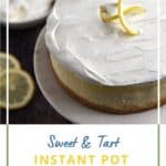 A whipped cream topped lemon cheesecake on a marble topped cake stand with bowls of whipped cream and lemon curd in the background with title graphic across the bottom.