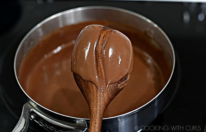 thick chocolate gravy with a line through the center on the back of a wooden spoon.
