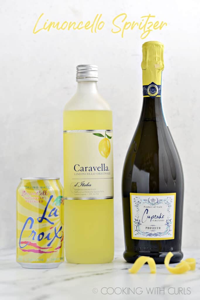A bottle of Prosecco, bottle of Limoncello and can of La Croix limoncello sparkling water. 