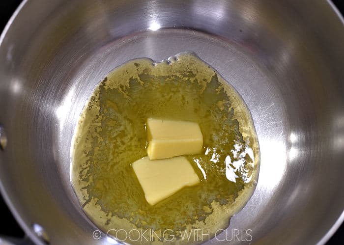 Butter melting in a metal saucepan. 