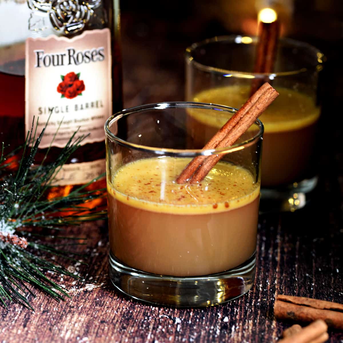 Hot Buttered Bourbon with apple cider, cinnamon sticks and nutmeg.