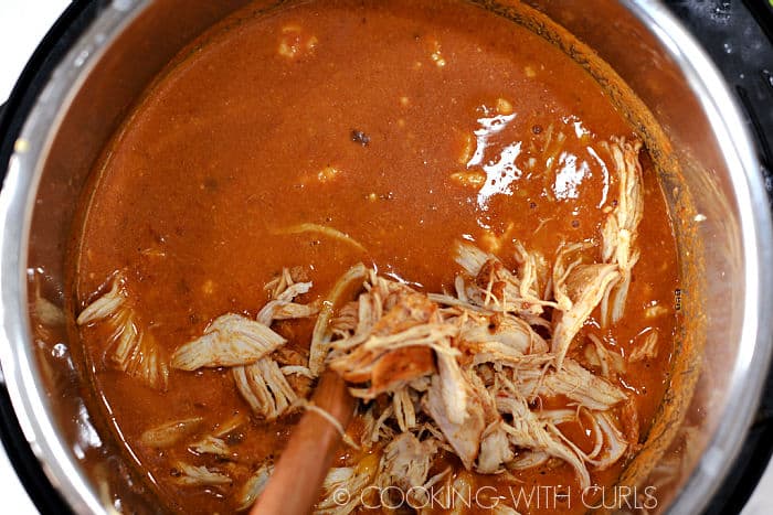 Shredded chicken added to the soup. 