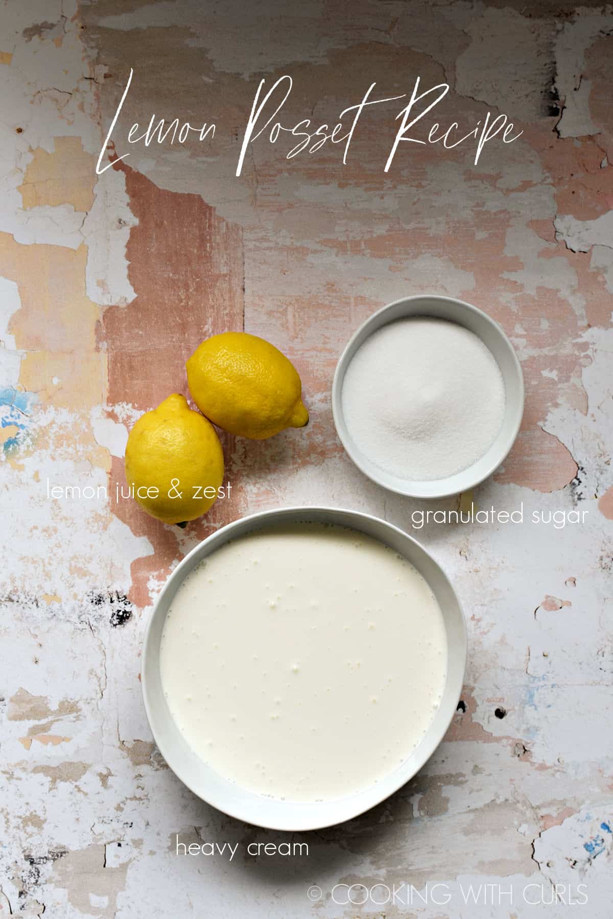Heavy cream, two lemons and a bowl of granulated sugar. 