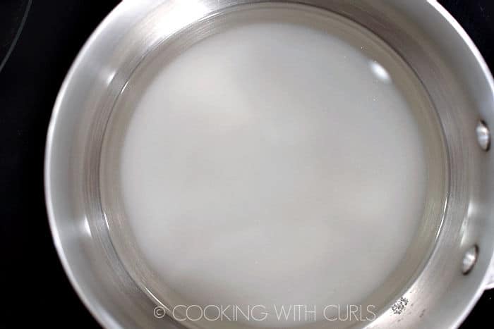 Sugar and water in a saucepan. 