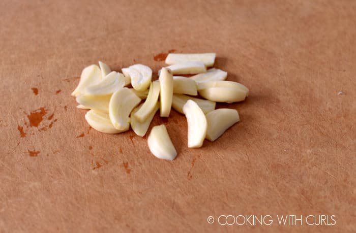 Garlic cloves cut into slivers.