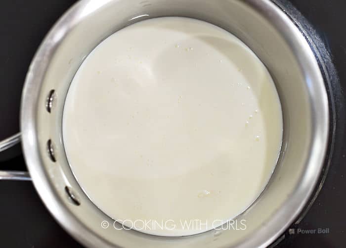 Heavy cream in a saucepan. 