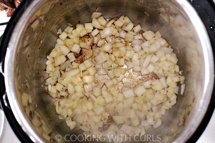 Sautéed, chopped onions in a pressure cooker. 