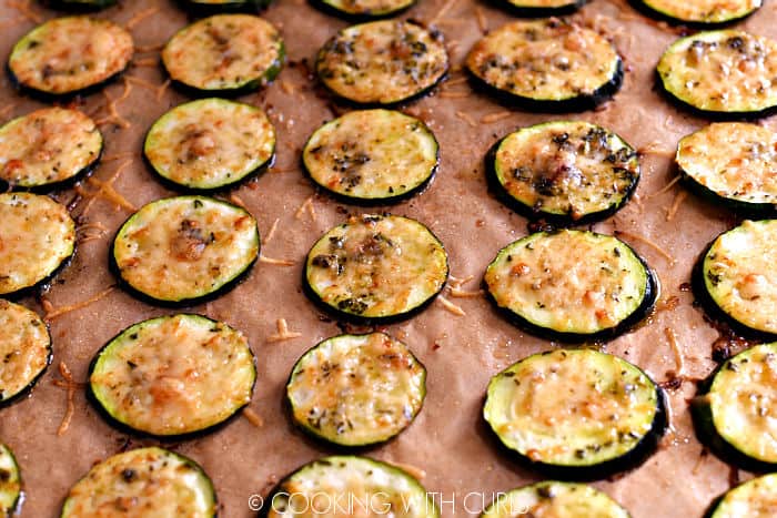Baked Parmesan Zucchini Bites on a parchment lined baking sheet. 