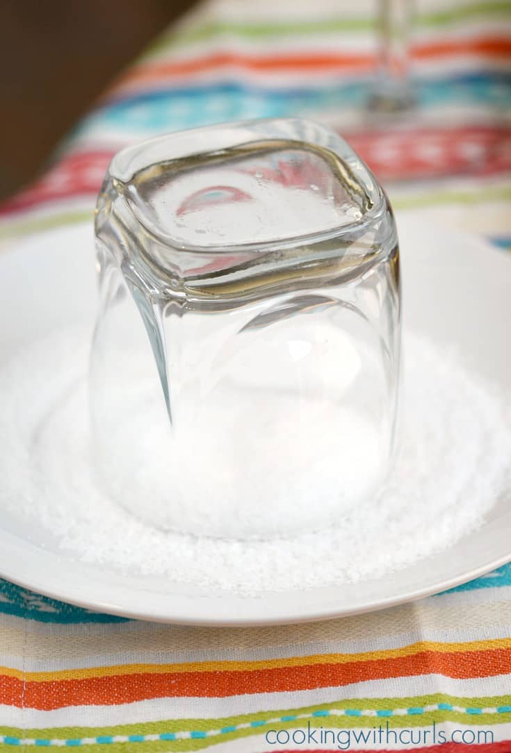 An upside down glass in a salt filled plate.