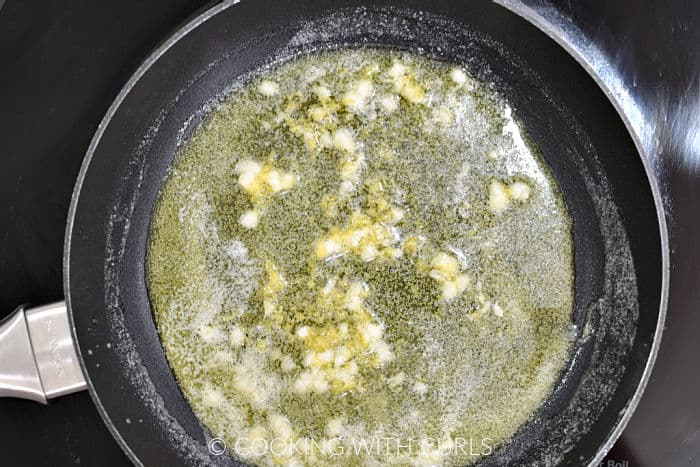 Melted butter, oil, minced garlic, and lemon zest in a small skillet. 