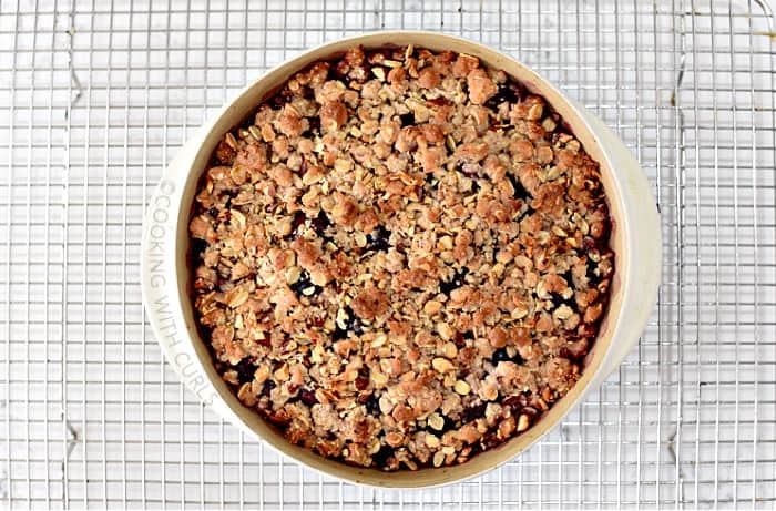 Baked Cherry Almond Crisp on a wire cooling rack. 