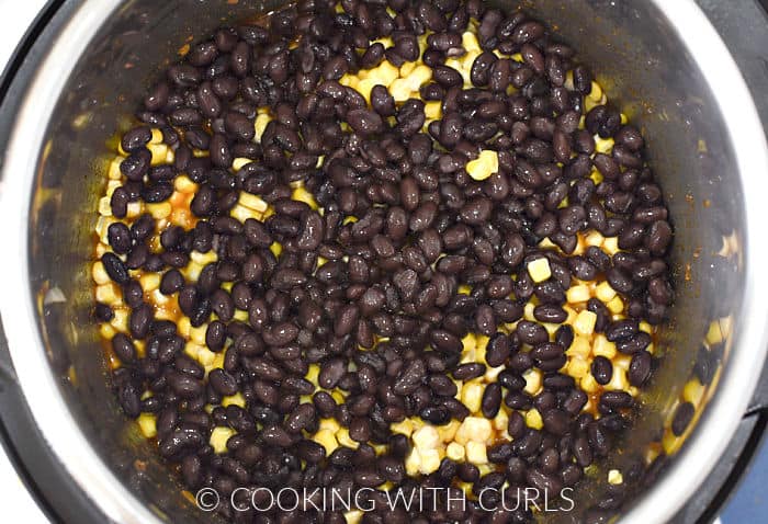 Beans and corn as the top layer in a pressure cooker. 