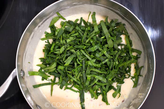 Chopped spinach added to the cheese sauce. 