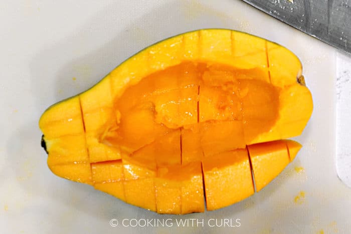Half of a fresh papaya sliced into cubes. 