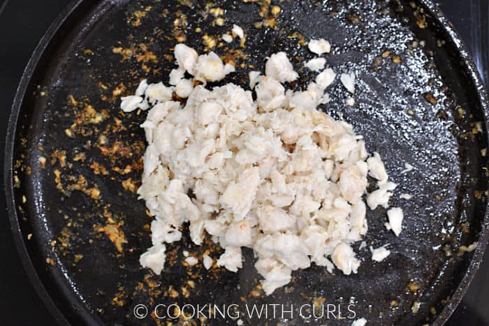 Lump crab meat on a cast iron griddle. 