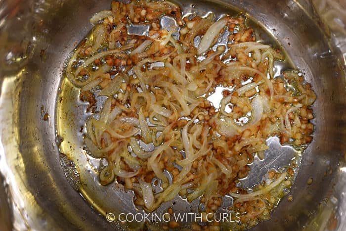Caramelized onions and garlic in a pot.