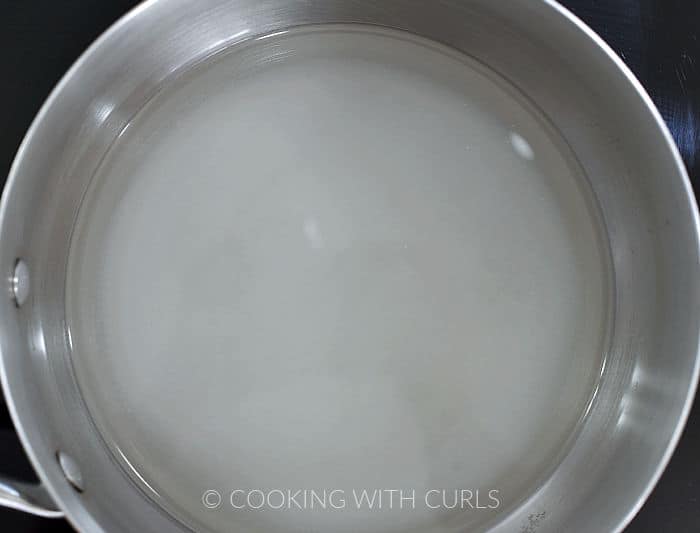 Sugar and water in a saucepan.
