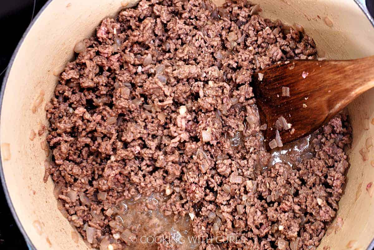 Ground beef cooked in a large pot. 