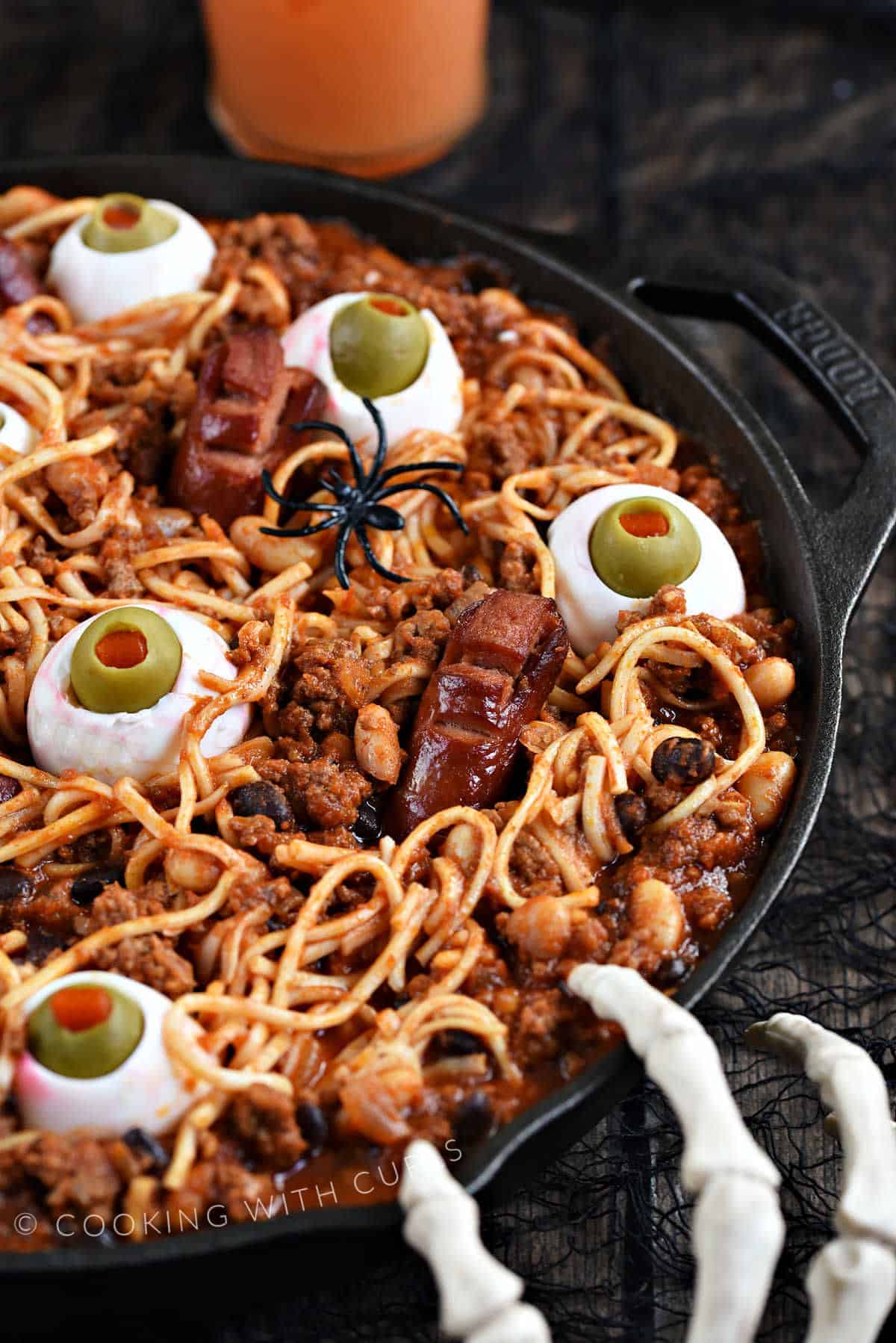 Spooky Halloween Chili with noodles, beans, egg eyes, and hot dog fingers and toes. 