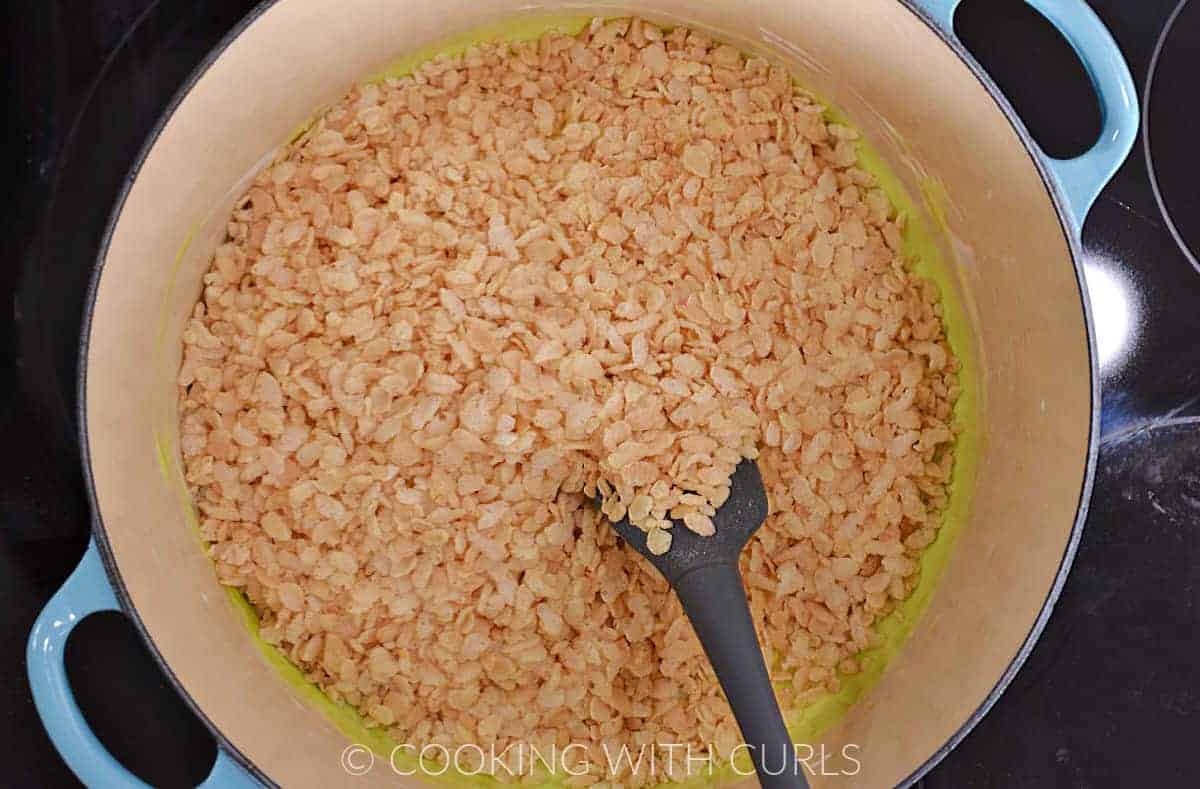 Crispy rice cereal added to the green marshmallow mixture. 