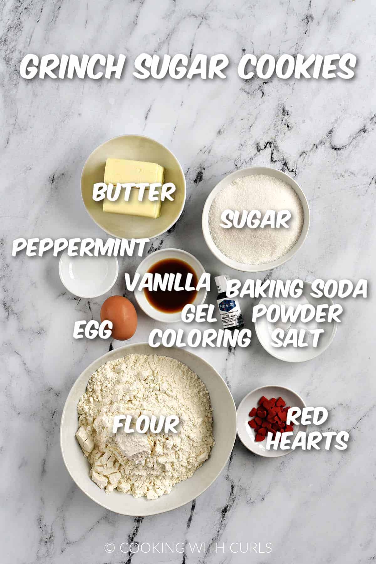 Butter, sugar, flavorings, egg, flour, gel coloring, baking powder, soda, and sea salt in bowls.