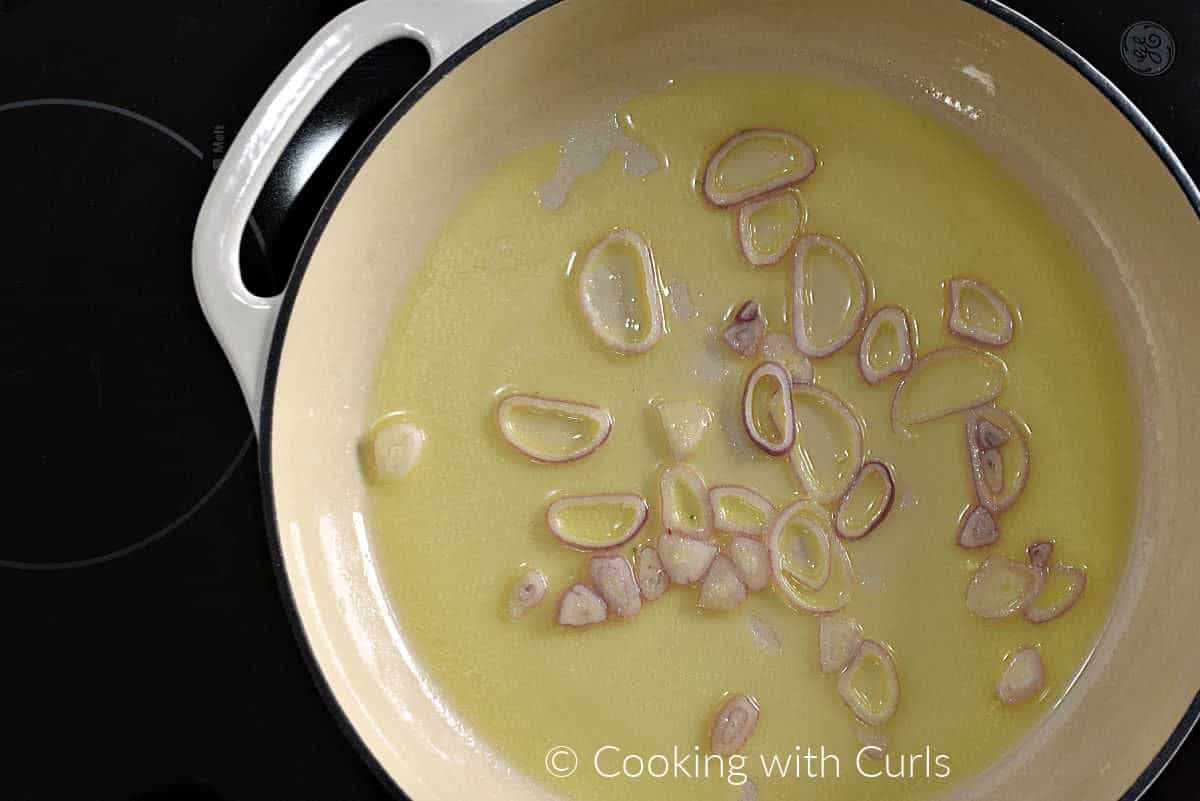 Melted butter and sliced shallots in a skillet. 