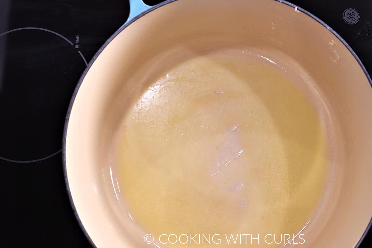 Melted butter in a large pot. 