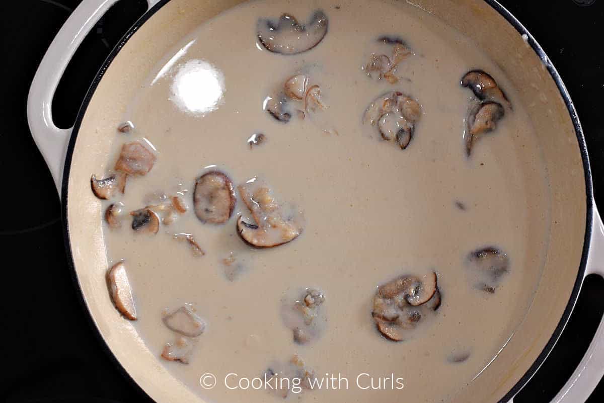 Mushrooms in a creamy sauce in a skillet. 