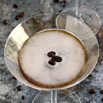 Espresso Martini topped with three coffee beans.