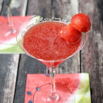 Watermelon Martini garnished with two watermelon balls on a toothpick.