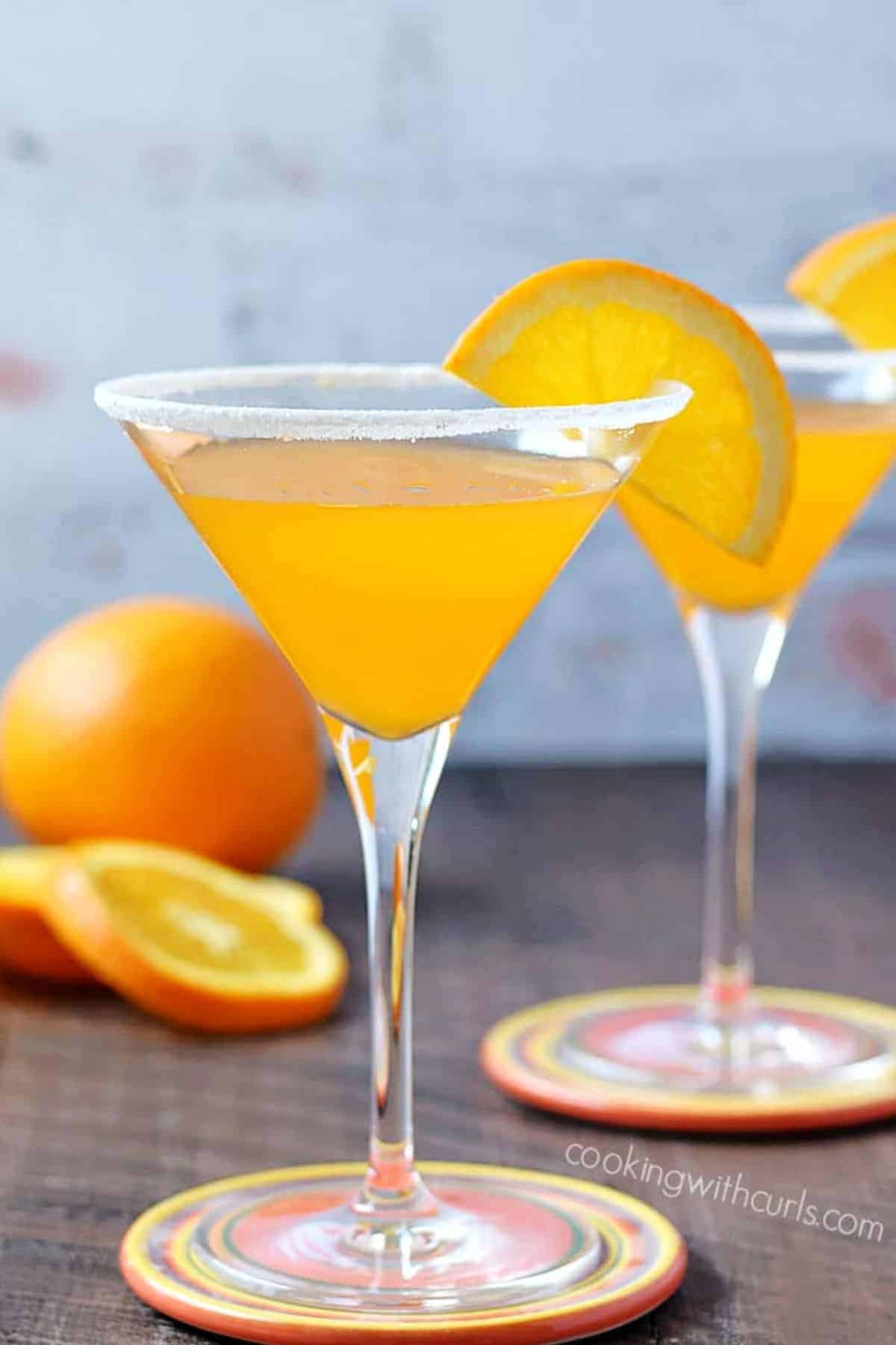 Two Orange Drop Martinis in sugar rimmed glasses. 