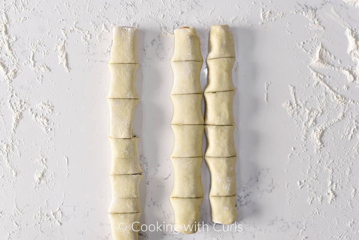 Long rolls of puff pastry wrapped sausage cut into 2-inch pieces. 
