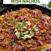 Corned Beef Irish Nachos with potato slices, melted cheddar cheese, corned beef, bacon, green onions, sour cream, diced tomatoes and avocado chunks with title graphic across the top.
