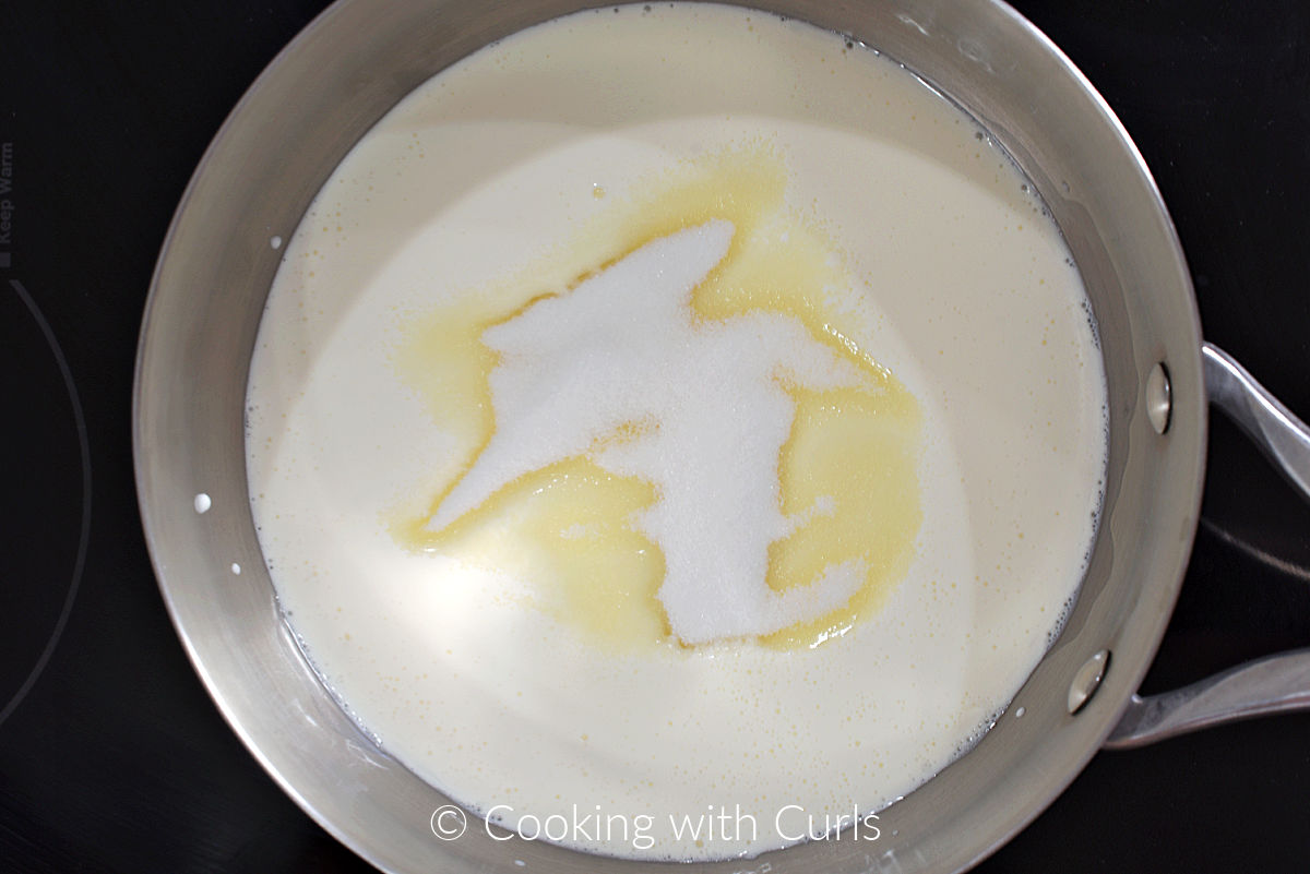 Milk, cream, vanilla and sugar in a saucepan. 