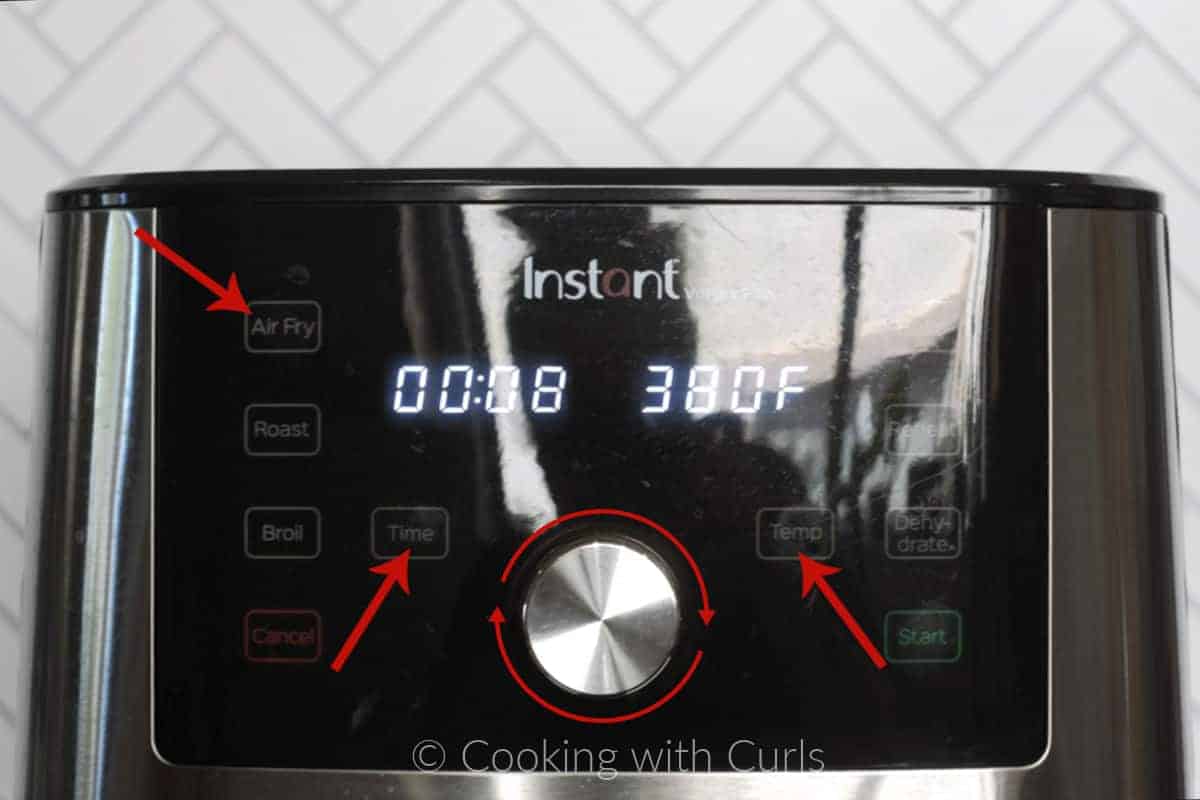 Air Fryer set for 8 minutes at 380 degrees with red arrows pointing to the display. 