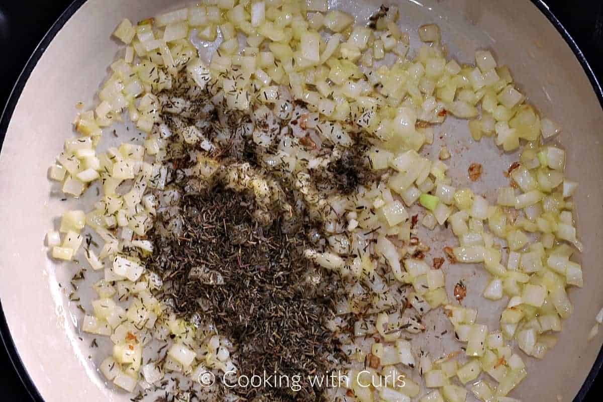 Diced onion, garlic and dried thyme in a skillet. 