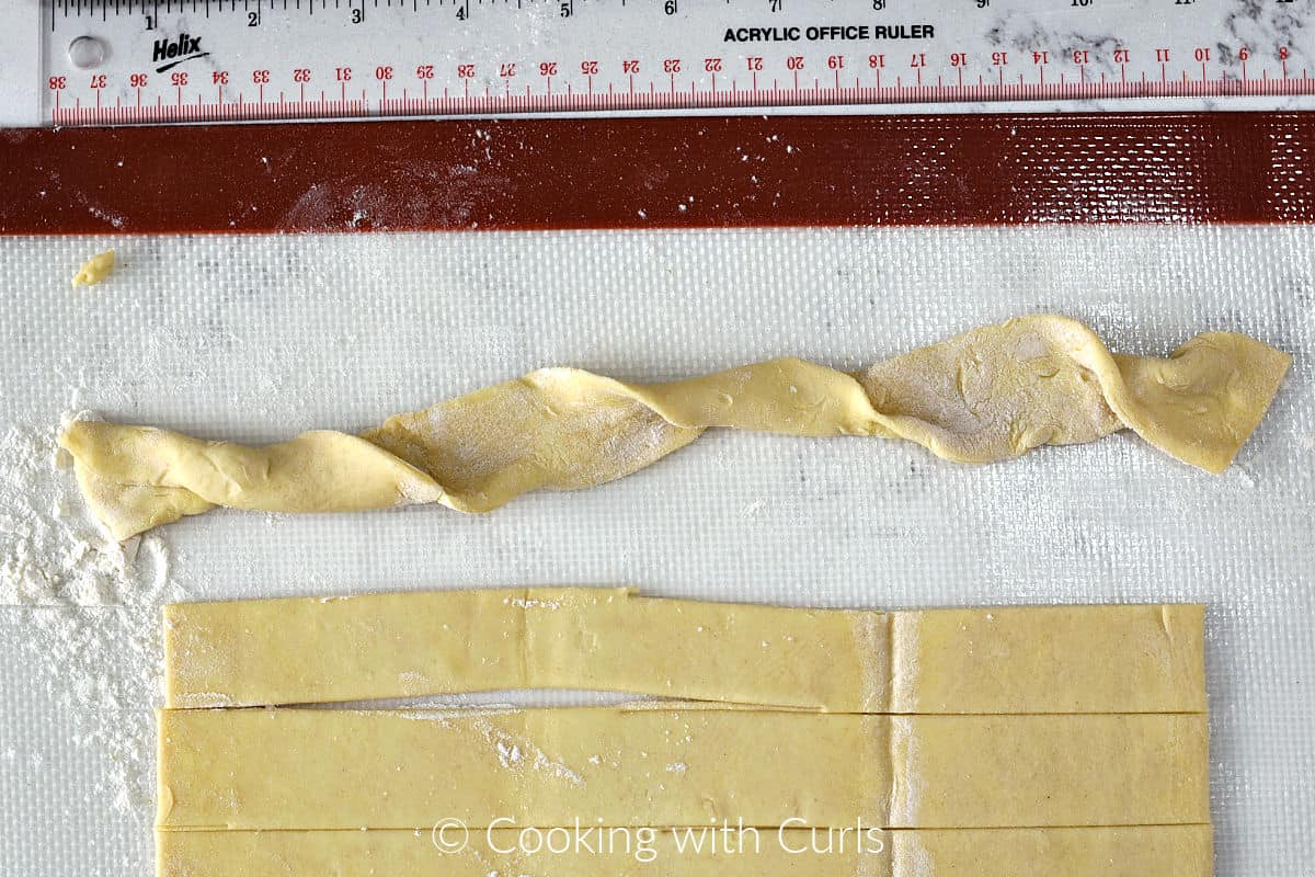 A strip of puff pastry twisted over. 