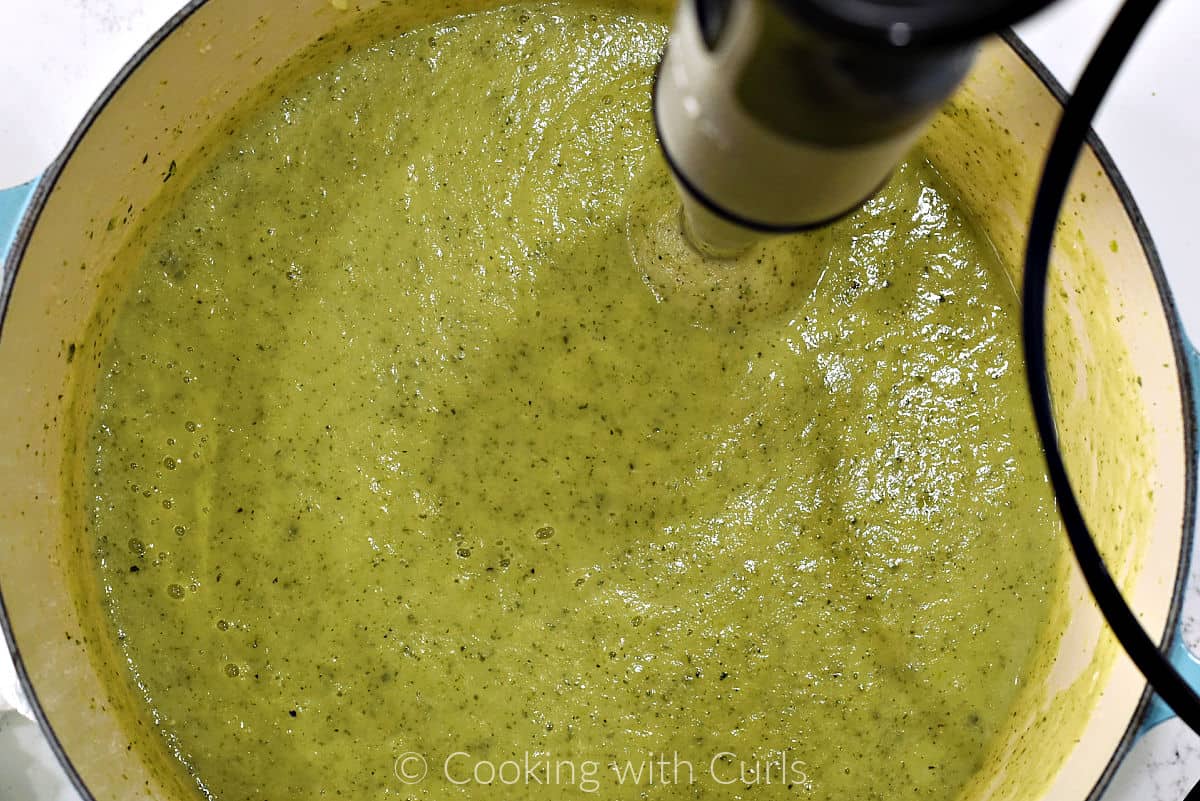 Zucchini Bisque pureed with an immersion blender in a large pot. 