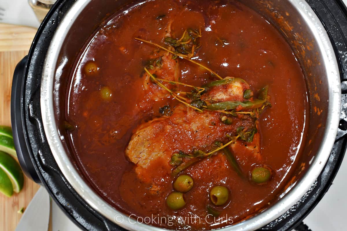 Pork chops cooked in veracruz sauce inside an instant pot. 